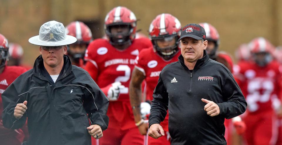 Jacksonville State head coach John Grass leads his team onto the field at Jacksonville State Stadium in Jacksonville, Alabama October 30, 2021. (Dave Hyatt : Hyatt Media LLC)