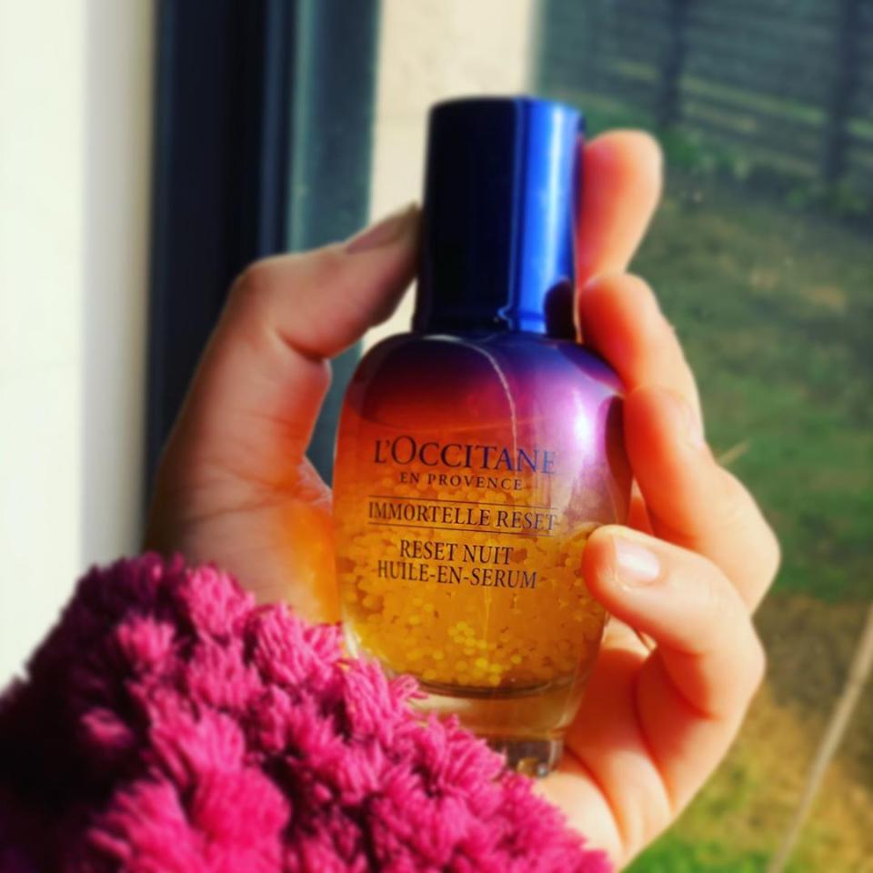 L’Occitane serum in woman's hand