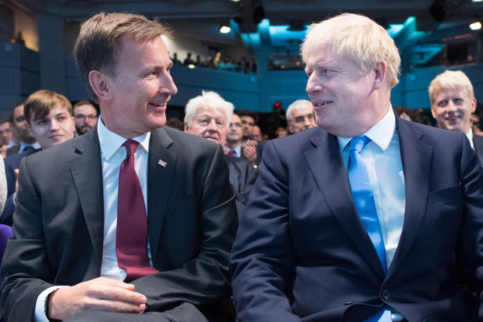 Conservative Party leadership contenders Boris Johnson (R) and Jeremy Hunt (L) sit together at an event to announce the winner of the party's leadership contest in central London on July 23, 2019. - Boris Johnson won the race to become Britain's next prime minister on Tuesday, heading straight into a confrontation over Brexit with Brussels and parliament, as well as a tense diplomatic standoff with Iran. (Photo by Stefan Rousseau / POOL / AFP)        (Photo credit should read STEFAN ROUSSEAU/AFP via Getty Images)