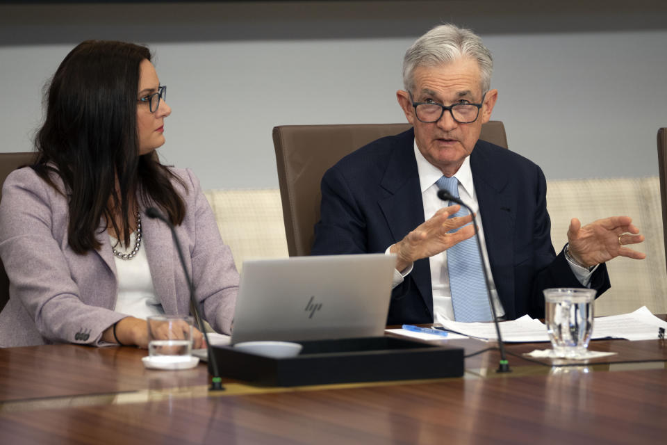 FTSE Federal Reserve Chairman Jerome Powell, right, speaks as Federal Reserve staff member Robin Cappetto, left, listens during a town hall meeting with teachers at the Federal Reserve Board Building, Thursday, Sept. 28, 2023, in Washington. (AP Photo/Mark Schiefelbein)