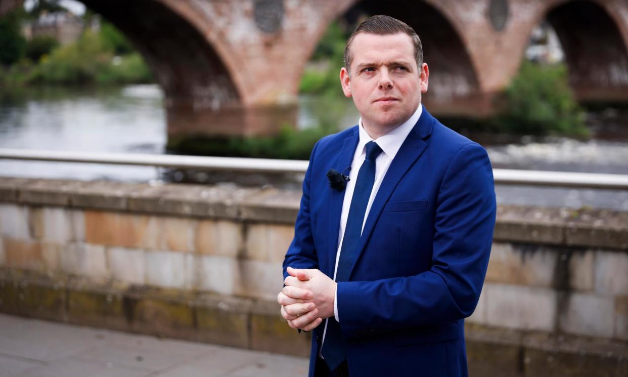 <span>Alongside his dual roles in two parliaments, Ross also works as a part-time match official for the SFA.</span><span>Photograph: Murdo MacLeod/The Guardian</span>