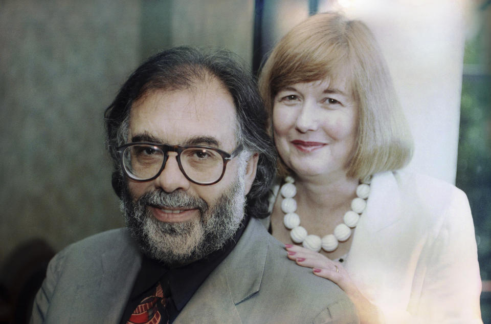 FILE - Francis Coppola and wife, Eleanor, pose July 16, 1991, in Los Angeles. Eleanor Coppola, who documented the making of some of her husband Francis Ford Coppola’s iconic films, including the infamously tortured production of “Apocalypse Now,” and who raised a family of filmmakers, died Friday, April 12, 2024. She was 87. (AP Photo/Chris Martinez, File)