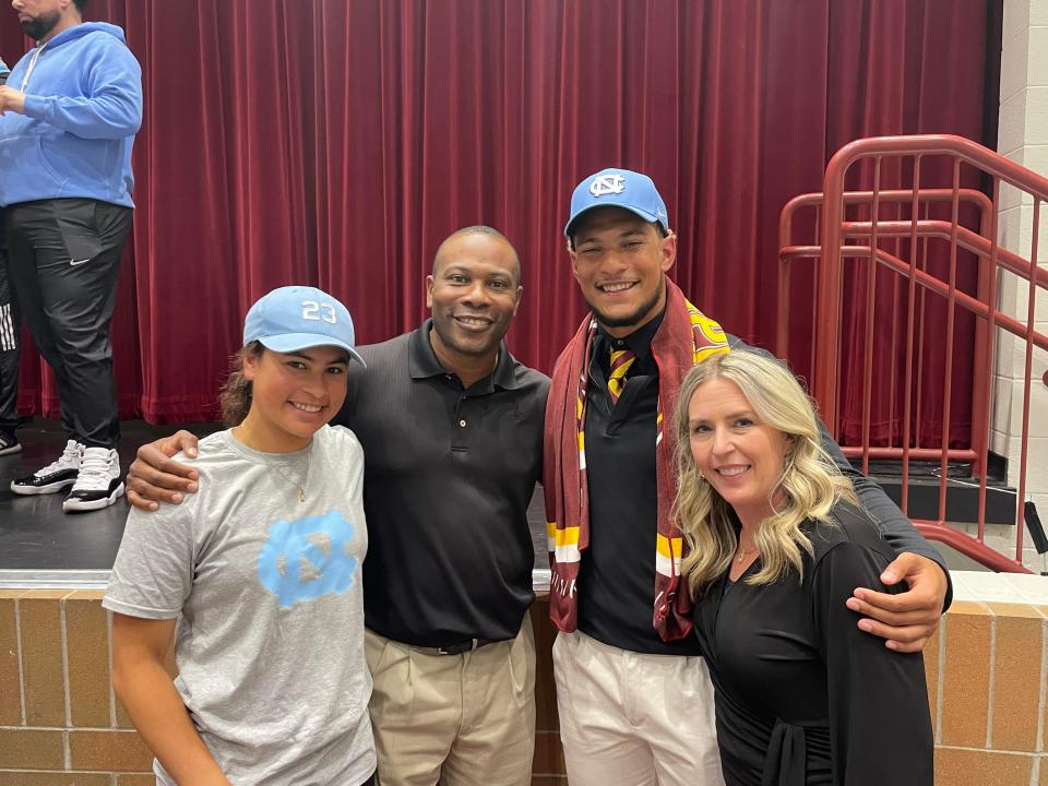 Austin Alexander of Cooper High School, third from left, celebrates his commitment to North Carolina Tar Heels football with is family, from left, sister, Maleah, dad, Durran, and mom, Heather.