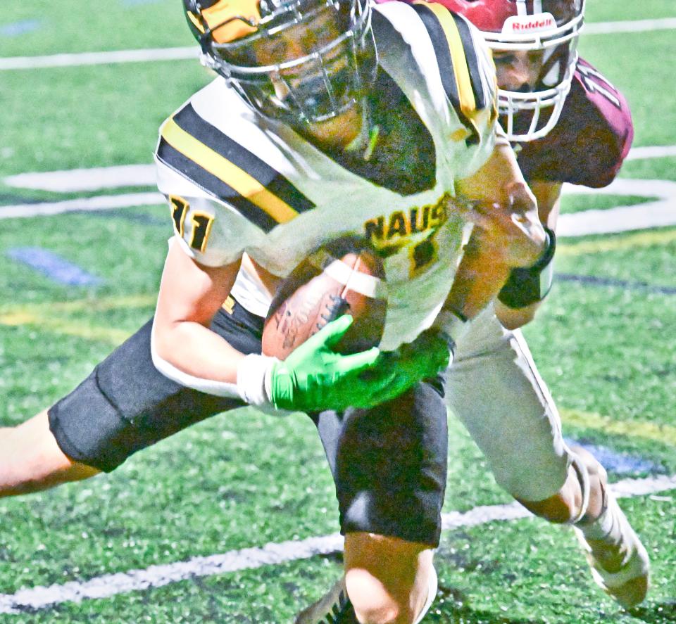 Kieran Handville of Nauset makes an over-the-shoulder touchdown catch defended by Fin Patierno of Falmouth.