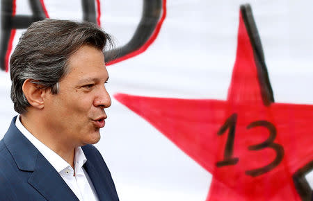 FILE PHOTO: Brazil's Workers Party (PT) presidential candidate Fernando Haddad leaves the Federal Police headquarters, where Brazilian former President Luiz Inacio Lula da Silva is imprisoned, after visiting him in Curitiba, Brazil September 17, 2018. REUTERS/Rodolfo Buhrer/File Photo