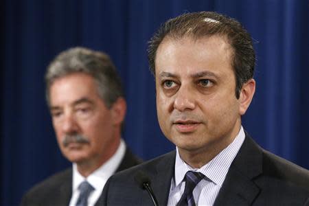 U.S. Attorney for the Southern District of New York Preet Bharara speaks during an announcement of a settlement with Anadarko Petroleum Corp at the Justice Department in Washington April 3, 2014. Anadarko Petroleum Corp and its Kerr-McGee unit will pay $5.15 billion (3.10 billion pounds) to resolve environmental cleanup claims stemming from the 2009 bankruptcy of paint materials maker Tronox, the biggest environmental bankruptcy settlement on record. At rear is U.S. Deputy Attorney General James Cole. REUTERS/Jonathan Ernst