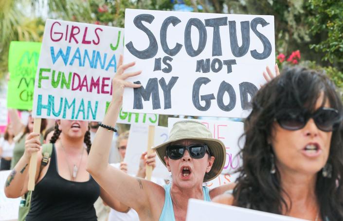 Hundreds of people protested the Supreme Court striking down of Roe V Wade during a pro choice rally and march through downtown Fort Walton Beach.