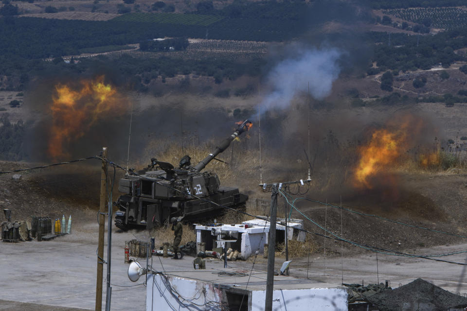 Israeli forces fire artillery from their position on the border with Lebanon after a barrage of rockets were fired from Lebanon, Friday, Aug. 6, 2021. The militant Hezbollah group said it fired rockets near Israeli positions close to the Lebanese border, calling it retaliation for Israeli airstrikes on southern Lebanon a day earlier. (Ayal Margolinc/ JINIPIX via AP)