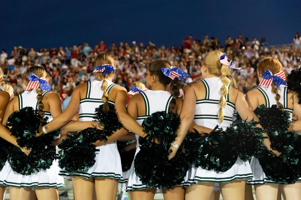 Olympus’s cheer team lead the student section at their football game against Provo at Olympus High School in Holladay on Friday, Aug. 18, 2023. | Megan Nielsen, Deseret News