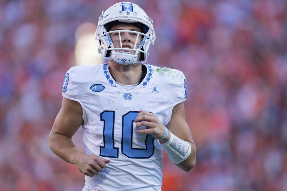 FILE - North Carolina quarterback Drake Maye (10) looks on during an NCAA college football game against Clemson Saturday, Nov. 18, 2023, in Clemson, S.C. North Carolina coach Mack Brown has a new name for the Duke's Mayo Bowl for his players: the “New Opportunity Bowl.” With star quarterback Maye and 11 others starters from the beginning of the season not playing in the bowl game either because they're preparing for the draft, entering the transfer portal or recovering from injuries, the Tar Heels (8-4) will largely be using this game against West Virginia to help evaluate young talent moving forward. (AP Photo/Jacob Kupferman, File)