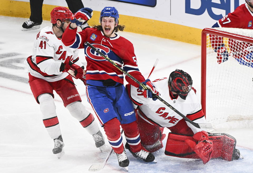 Montreal Canadiens' Michael Pezzetta (55) celebrates his goal against Carolina Hurricanes goaltender Frederik Andersen, next to Hurricanes' Shayne Gostisbehere (41) during the second period of an NHL hockey game Tuesday, March 7, 2023, in Montreal. (Graham Hughes/The Canadian Press via AP)