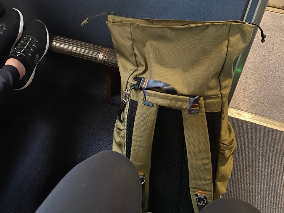 The writer's backpack and no desk in her train seat