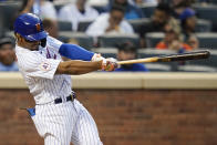 New York Mets' Francisco Lindor follows through on a two-run home run during the sixth inning in the first baseball game of a doubleheader against the Miami Marlins Tuesday, Sept. 28, 2021, in New York. The Mets won 5-2. (AP Photo/Frank Franklin II)