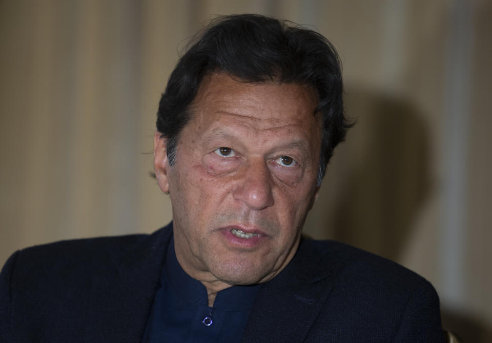 Pakistan's Prime Minister Imran Khan speaks to The Associated Press, in Islamabad, Pakistan, Monday, March 16, 2020. Khan said Monday he fears the new coronavirus will devastate developing nations' economies, and warned richer economies to prepare to write off the debts of the world's poorer countries. In the interview he also called for an end to sanctions on Iran saying they were crippling the poor nation's ability to even contain the spread of the coronavirus. For most people, the virus causes only mild or moderate symptoms. For some it can cause more severe illness. (AP Photo/B.K. Bangash)