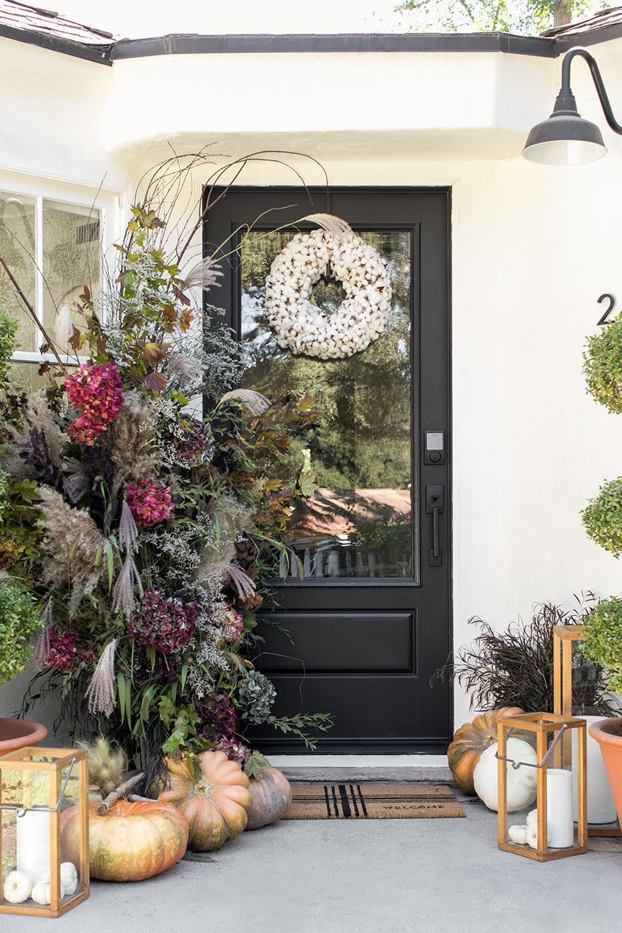 <p>Lanterns? Check. Pumpkins? Got 'em. Wreaths? You betcha. Just throw in a gorgeous seasonal floral arrangement (like the one on this gorgeous front porch from <a href="https://sugarandcharm.com/" rel="nofollow noopener" target="_blank" data-ylk="slk:Sugar & Charm;elm:context_link;itc:0;sec:content-canvas" class="link ">Sugar & Charm</a>) and it's a done deal.</p>