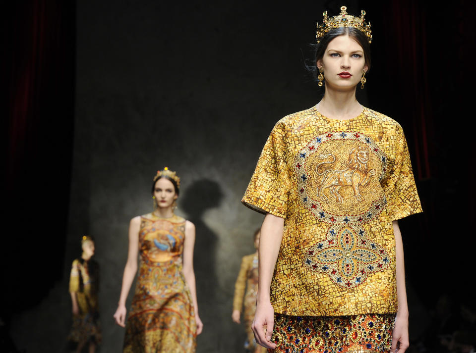 Models wear creations for Dolce & Gabbana women's Fall-Winter 2013-14 collection, part of the Milan Fashion Week, unveiled in Milan, Italy, Sunday, Feb. 24, 2013. (AP Photo/Giuseppe Aresu)