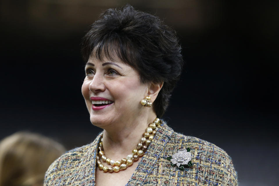 FILE - In this Nov. 24, 2019, file photo, New Orleans Saints owner Gayle Benson watches the team warm up, before an NFL football game against the Carolina Panthers in New Orleans. An Associated Press review of public tax documents found that the Bensons' foundation has given at least $62 million to the Archdiocese of New Orleans and other Catholic causes over the past dozen years, including gifts to schools, universities, charities and individual parishes. (AP Photo/Butch Dill, File)