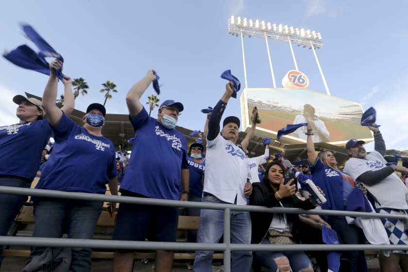 Los Angeles, CA - October 20: Los Angeles Dodgers fans wave their towels to cheer before game four in the 2021 National League Championship Series against the Atlanta Braves at Dodger Stadium on Wednesday, Oct. 20, 2021 in Los Angeles, CA. (Luis Sinco / Los Angeles Times)