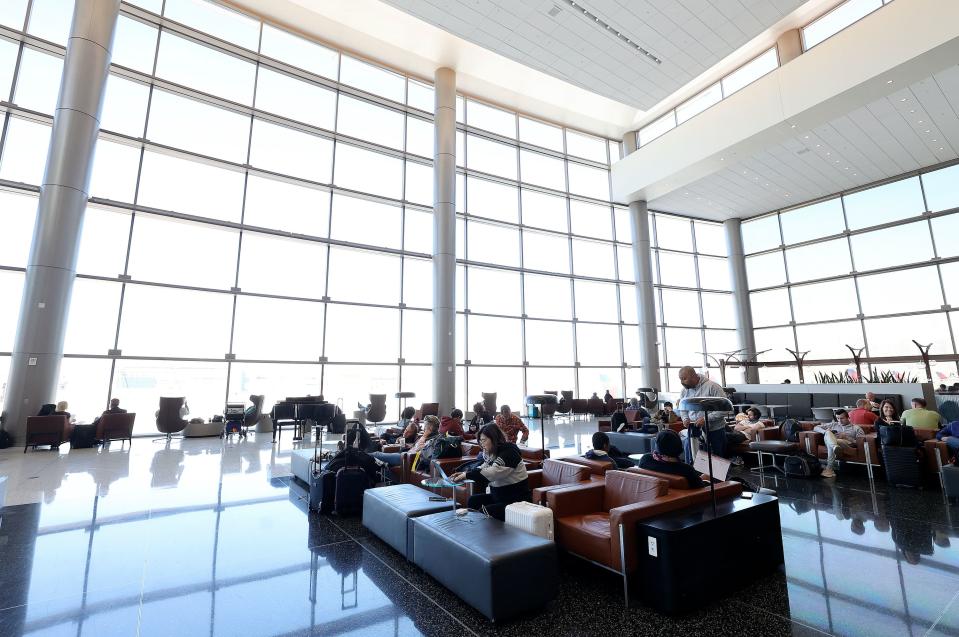 People lounge at Salt Lake City International Airport in Salt Lake City on Tuesday, Oct. 31, 2023. | Kristin Murphy, Deseret News