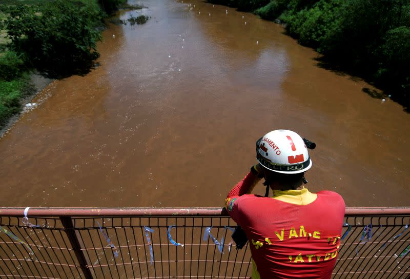 FILE PHOTO: Rescue worker reacts during a demonstration in honor of victims of the collapse of a dam owned by Brazilian mining company Vale SA, in Brumadinho