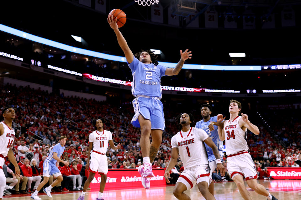 RALEIGH, NORTH CAROLINA – JANUARY 10: Elliot Cadeau #2 of the North Carolina Tar Heels goes to the basket during the first half against the NC State Wolfpack at PNC Arena on January 10, 2024 in Raleigh, North Carolina. (Photo by Lance King/Getty Images)