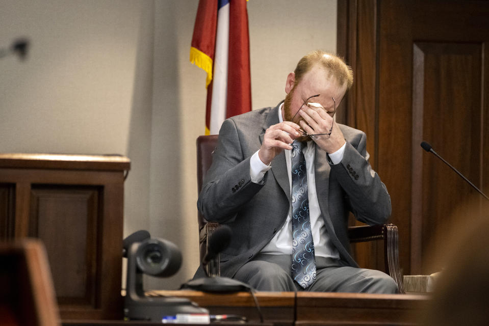 Travis McMichael reacts to question during his testimony in the trial of he and his father Greg McMichael and neighbor William "Roddie" Bryan in the Glynn County Courthouse, Wednesday, Nov. 17, 2021, in Brunswick, Ga. The three are charged with the February 2020 slaying of 25-year-old Ahmaud Arbery. (AP Photo/Stephen B. Morton, Pool)