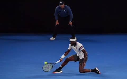 Frances Tiafoe of the US plays a forehand return to Spain's Rafael Nadal during their men's singles quarter-final match on day nine of the Australian Open tennis tournament in Melbourne on January 22, 2019 - Credit: AFP