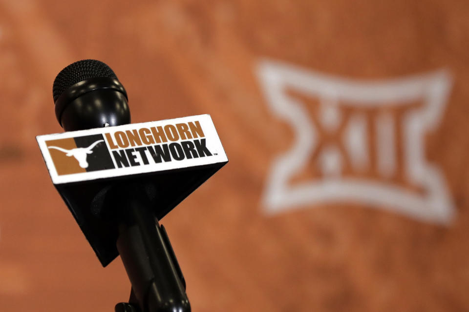 FILE - A Longhorn Network flag is seen on a microphone prior to a news conference, Thursday, Aug. 2, 2018, in Austin, Texas. Now with Texas set to join the Southeastern Conference, the Longhorn Network is set to quietly fold into the SEC network, shuttering a pioneering effort that briefly rocked not just the Big 12, but college football. (AP Photo/Eric Gay, File)
