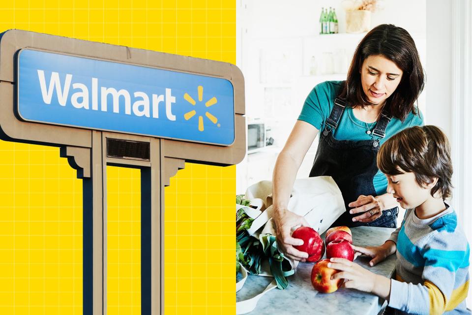 A Walmart sign next to a mother and child unpacking groceries