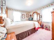 <p>The master bedroom is also home to plenty of clown-themed elements. (Zoocasa) </p>