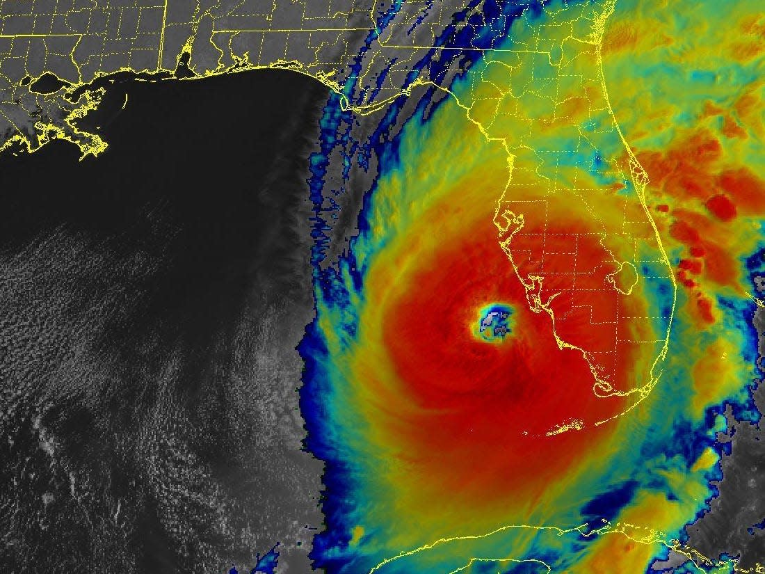infrared satellite image shows hurricane ian eye just off the coast of florida