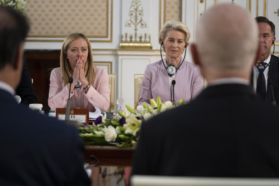 FILE - From left, Italian Premier Giorgia Meloni, European Commission President Ursula von der Leyen, and Dutch Prime Minister Mark Rutte meet with Tunisian President Kais Saied, right back to the camera, in Tunis, Sunday, June 11, 2023. When Giorgia Meloni took office a year ago as the first far-right premier in Italy's post-war history, concern was palpable abroad about the prospect of democratic backsliding and resistance to European Union rules. But since being sworn in as premier on Oct. 22, 2022, Meloni has confounded Western skeptics. (Italian Premier Office via AP, File)