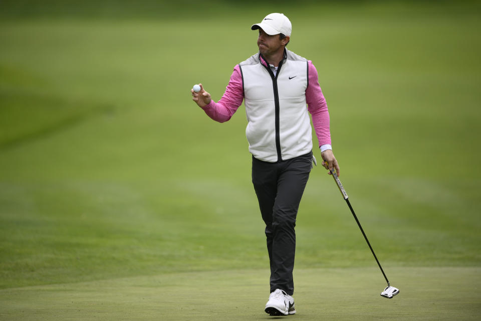 Rory McIlroy, of Northern Ireland, waves after making a putt on the 10th hole during the final round of the Wells Fargo Championship golf tournament, Sunday, May 8, 2022, at TPC Potomac at Avenel Farm golf club in Potomac, Md. (AP Photo/Nick Wass)