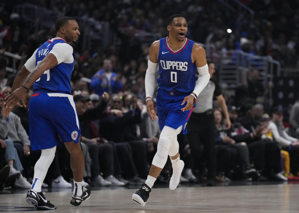 Los Angeles Clippers guard Russell Westbrook (0) celebrates after shooting a 3-pointer during the first half of an NBA basketball game against the Los Angeles Lakers in Los Angeles, Tuesday, Jan. 23, 2024. (AP Photo/Ashley Landis)