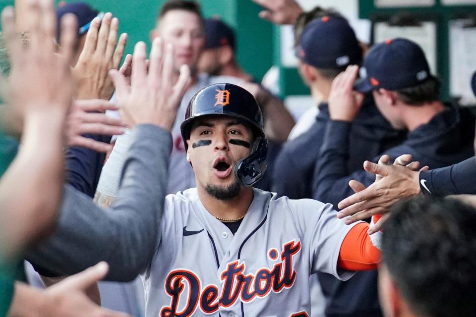 Tigers shortstop Javier Baez celebrates in the dugout against the Royals after scoring in the first inning on Monday, May 22, 2023, in Kansas City, Missouri.