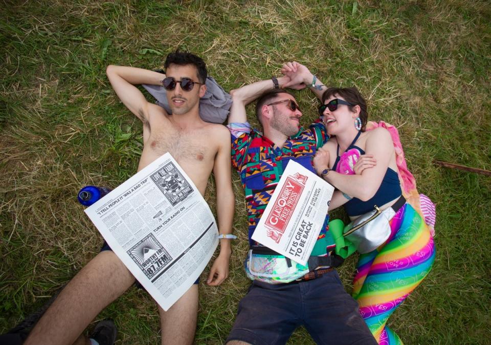 Festival-goers enjoy the sunshine (EPA)