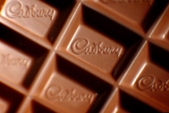 Embargoed to 0001 Wednesday March 5File photo dated 09/11/09 of a closeup of a Cadbury logo in a bar of Dairy Milk chocolate as Cadbury has been voted the UK's happiest brand, followed by British toilet roll company Andrex and search engine Google. PRESS ASSOCIATION Photo. Issue date: Wednesday March 5, 2014. Fairy detergents and Nivea took fourth and fifth place, followed by YouTube and Amazon, while Mars, Walkers and Heinz completed the top 10, the poll for advertising agency Isobel found. Meanwhile, the bottom 10 of the 100-strong ranking was littered with political parties, banks and the airline Ryanair. See PA story CONSUMER Happy. Photo credit should read: Dominic Lipinski/PA Wire