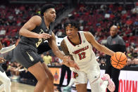 Louisville forward JJ Traynor (12) drives against Georgia Tech guard Dallan Coleman (3) during the second half of an NCAA college basketball game in Louisville, Ky., Wednesday, Feb. 1, 2023. Louisville won 68-58. (AP Photo/Timothy D. Easley)