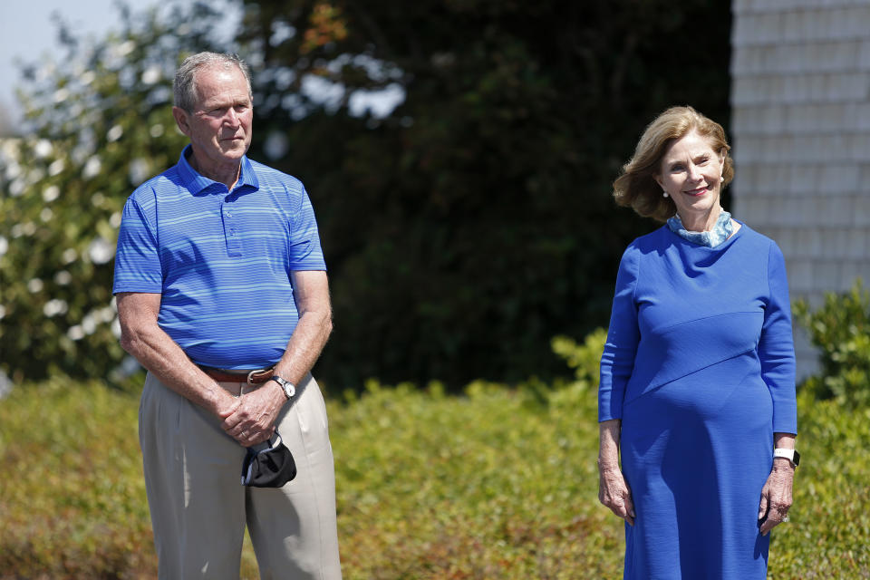 Former President George W. Bush and his wife Laura Bush look on after speaking about Sen. Susan Collins, R-Maine, Friday, Aug. 21, 2020, in Kennebunkport, Maine. (AP Photo/Mary Schwalm)