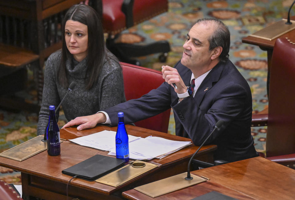 Sen. Andrew J. Lanza. R-Staten Island, right, debates legislation to approve a legislative pay raise during a special legislative session in the Senate Chamber at the state Capitol Thursday, Dec. 22, 2022, in Albany, N.Y. (AP Photo/Hans Pennink)