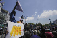 FILE - Sri Lankans shout slogans during a protest against the government increasing income tax to manage day to day expenses amid an unprecedented economic crisis in Colombo, Sri Lanka, on Feb. 22, 2023. The International Monetary Fund said Monday, March 21, that its executive board has approved a nearly $3 billion bailout program for Sri Lanka over four years to help salvage the country's bankrupt economy. (AP Photo/Eranga Jayawardena, File)