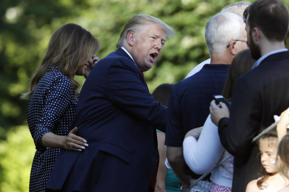 President Donald Trump and first lady Melania Trump greet attendees of the annual Congressional Picnic on the South Lawn of the White House, Friday, June 21, 2019, in Washington. (AP Photo/Jacquelyn Martin)