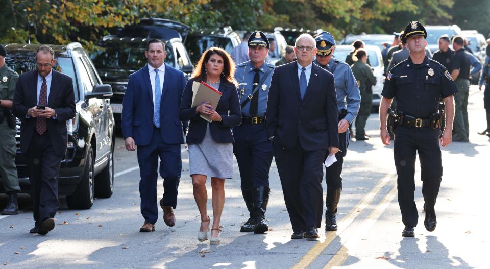 Plymouth District Attorney Timothy Cruz walks to his press conference as Massachusetts State Police and New Hampshire State Police search the Ames Nowell State Park area in Abington for missing 5-year-old Elijah Lewis of Merrimack, New Hampshire on Friday, Oct. 22, 2021.