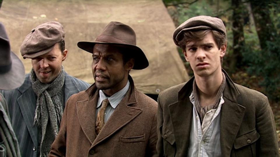 Andrew Garfield standing with three other men in Doctor Who.
