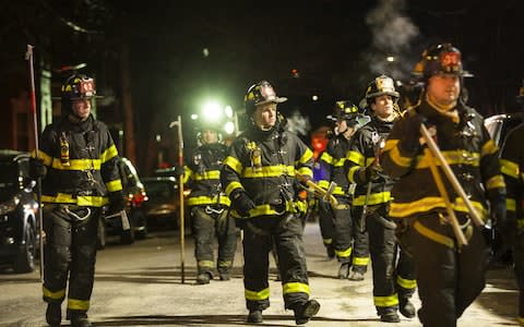 Firefighters leave after putting out the major fire - Credit:  Amir Levy/ Getty 