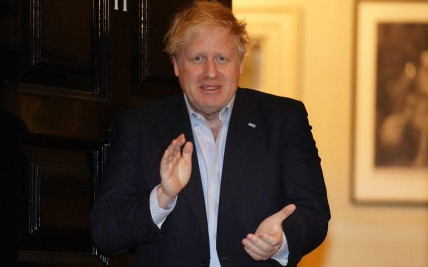 Boris Johnson, still in isolation while recovering from coronavirus, adds his applause to the national 'clap for carers' tribute to NHS workers - PIPPA FOWLES