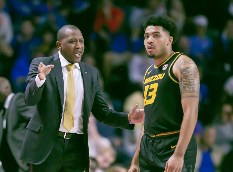 Missouri head coach Dennis Gates talks with forward Ronnie DeGray III (13) during the first half of an NCAA college basketball game against Florida Saturday, Jan. 14, 2023, in Gainesville, Fla. (AP Photo/Alan Youngblood)