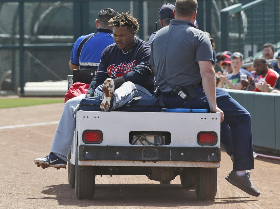 Cleveland Indians' Jose Ramirez is taken off the field on a cart after an injury during the third inning of the team's spring training baseball game against the Chicago White Sox on Sunday, March 24, 2019, in Glendale, Ariz. (AP Photo/Sue Ogrocki)