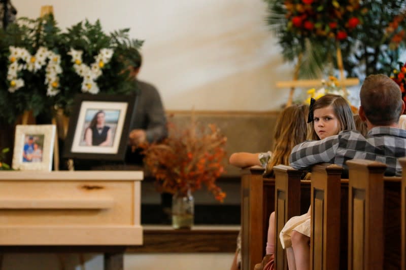 Relatives of Christina Marie Langford Johnson, who was killed by unknown assailants, attend her funeral service before a burial at the cemetery in LeBaron, Chihuahua