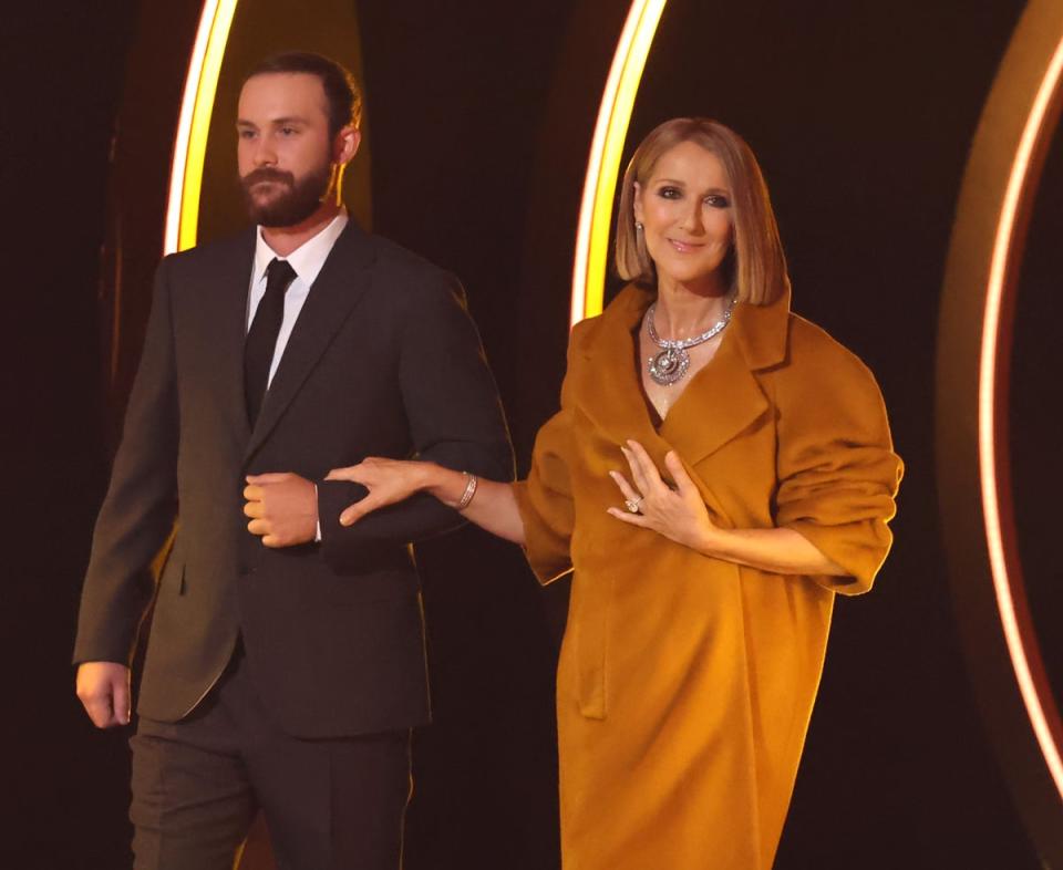 Céline Dion is escorted by son René-Charles Angélil onstage during the 66th Grammy Awards on 4 February 2024 (Getty Images)